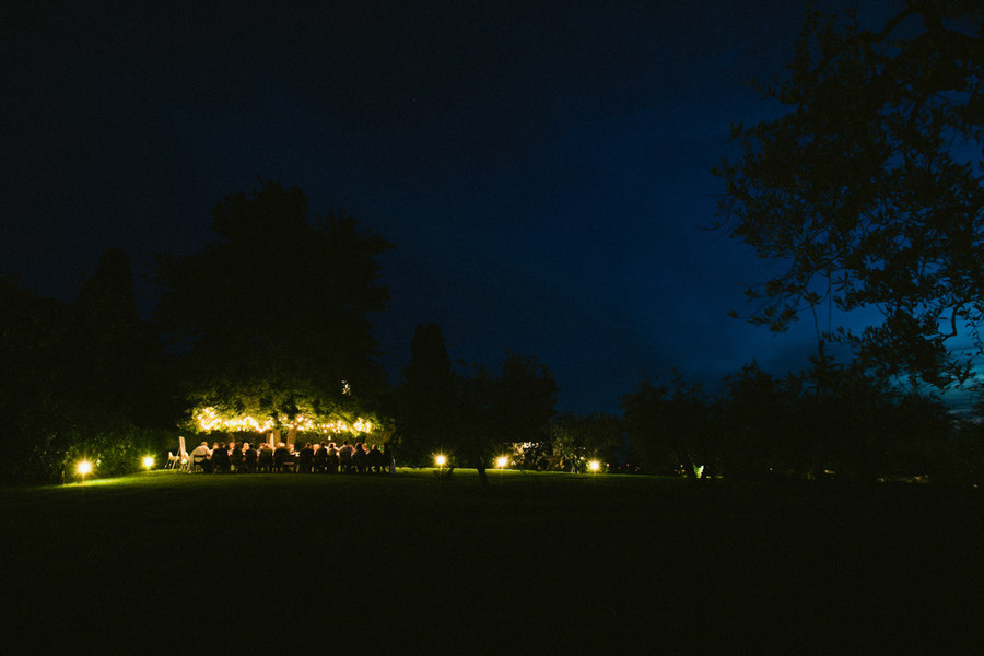 wedding dinner under a tree in tuscany