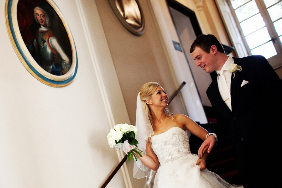 bride and groom walking down the stairs in Villa Durazzo