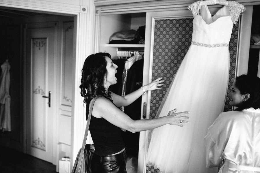Hotel Regina Palace Stresa, bridemaid watching bride's wedding dress for the first time