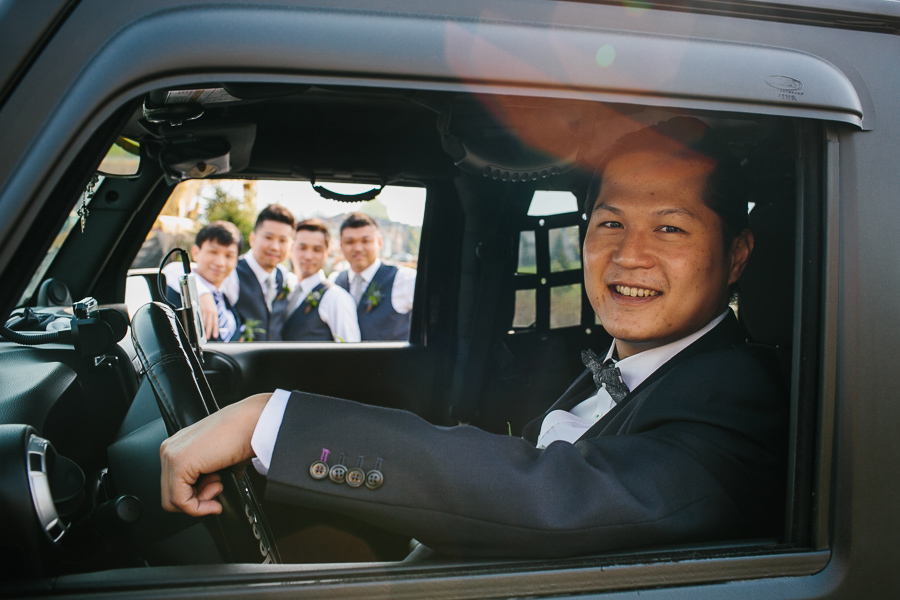 Groom and groomsmen wedding photo with jeep