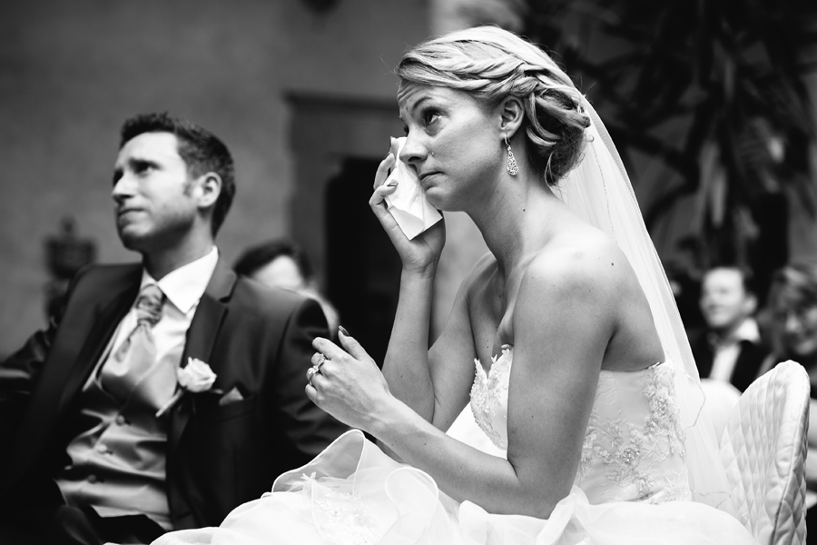 Bride crying with tears during ceremony
