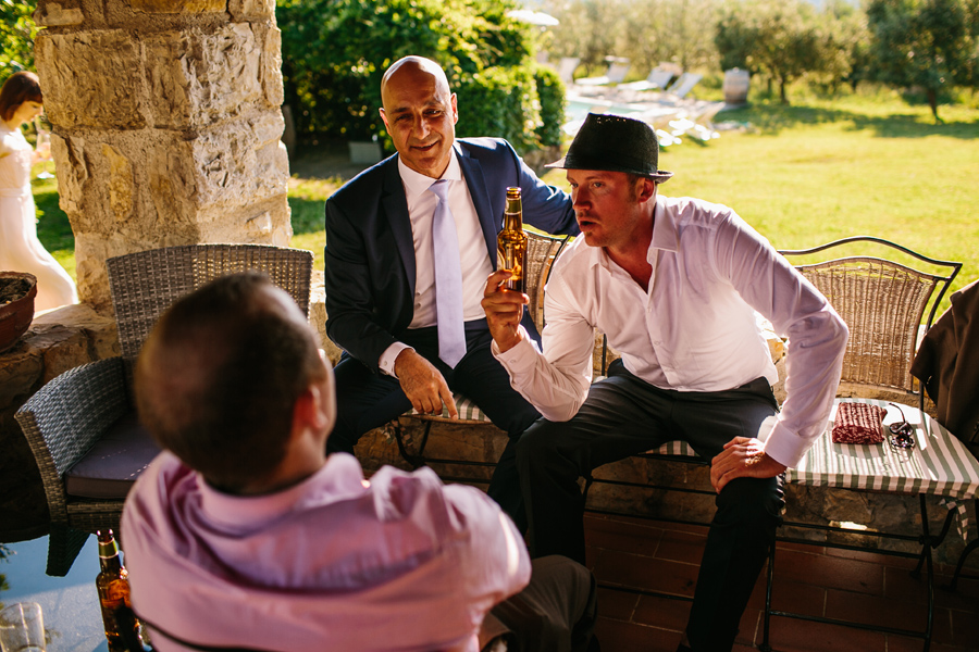 Wedding guests having a beer at castello del trebbio