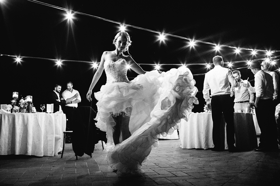 Bride dancing with her wedding dress