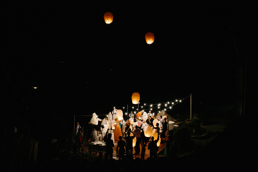 Flying paper lanterns At wedding in Italy