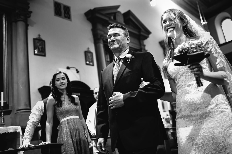 bride entering church in florence with her father