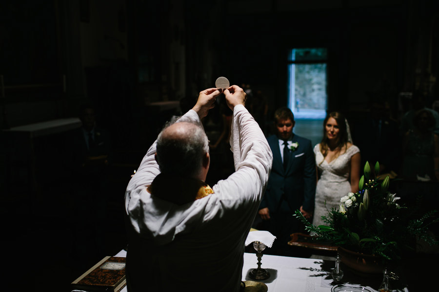 priest during catholic wedding ceremony in florence