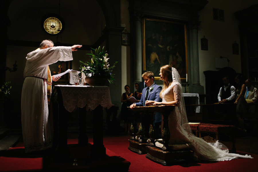 priest during catholic wedding ceremony in florence