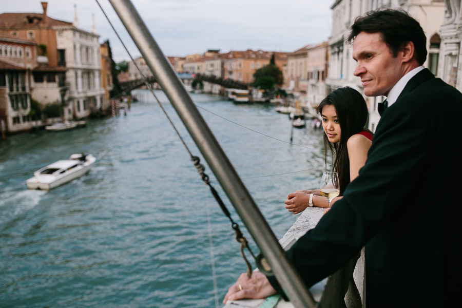 Wedding guests watching canal grande in venice