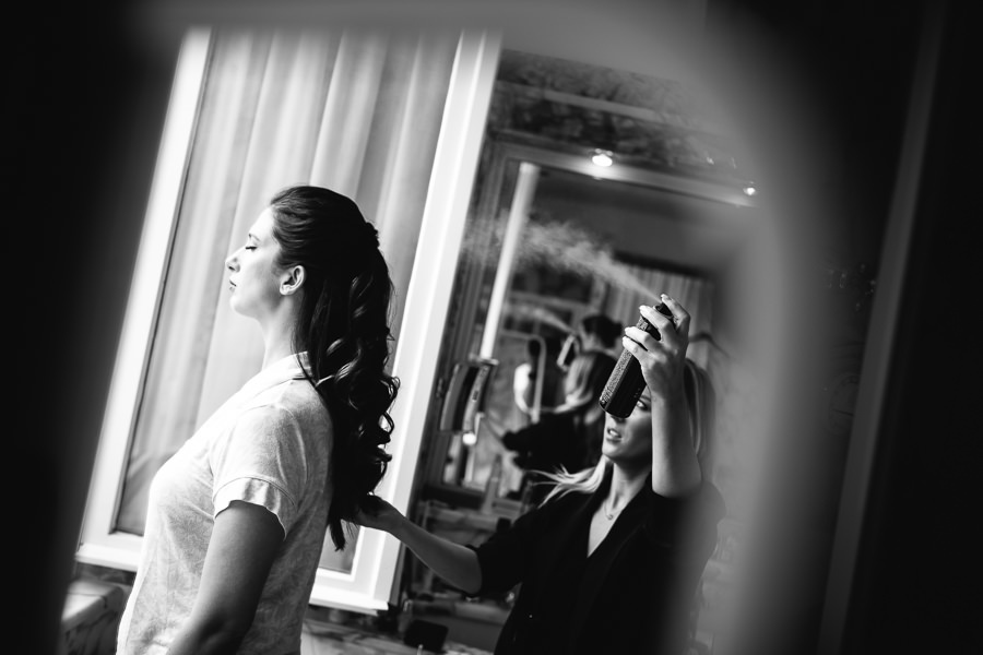bride and hairstylist before wedding
