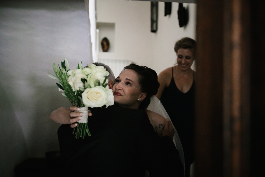 bride hugging her father before wedding ceremony