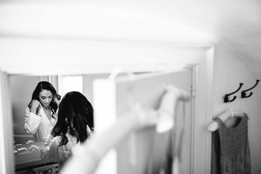 bride in front of mirror before her wedding in apulia