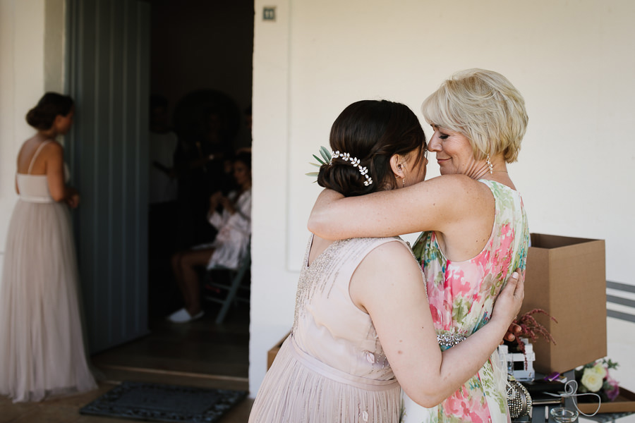 mom and daughter hugging at puglia wedding in fasano
