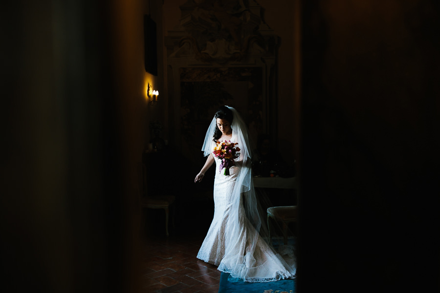 beautiful bride portrait in her dressing room at castello di meleto