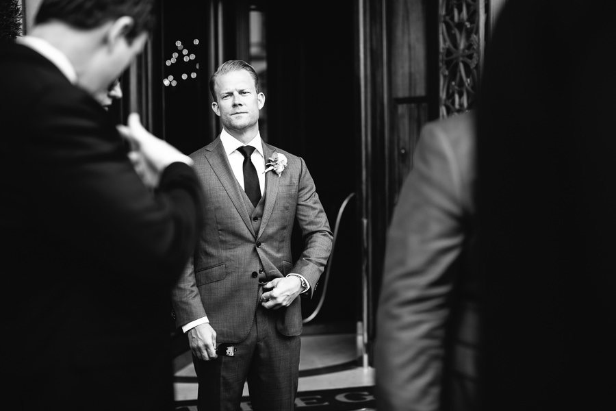 groom in front of st. regis hotel in florence