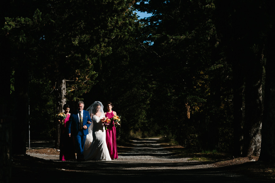 bride dad walking down the aisle at castello di meleto