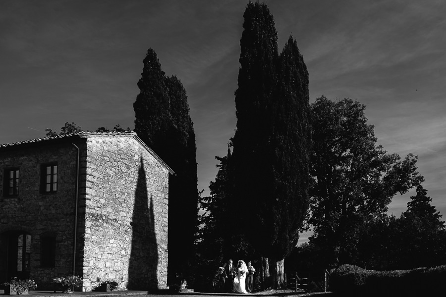 black and white wedding photograph bride walking down the aisle