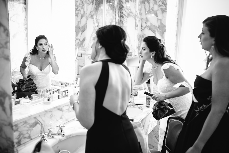 bride and best friend in front of mirror