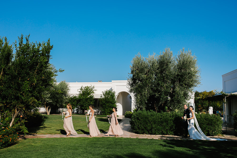 bride and her father walking down the aisle at wedding in apulia