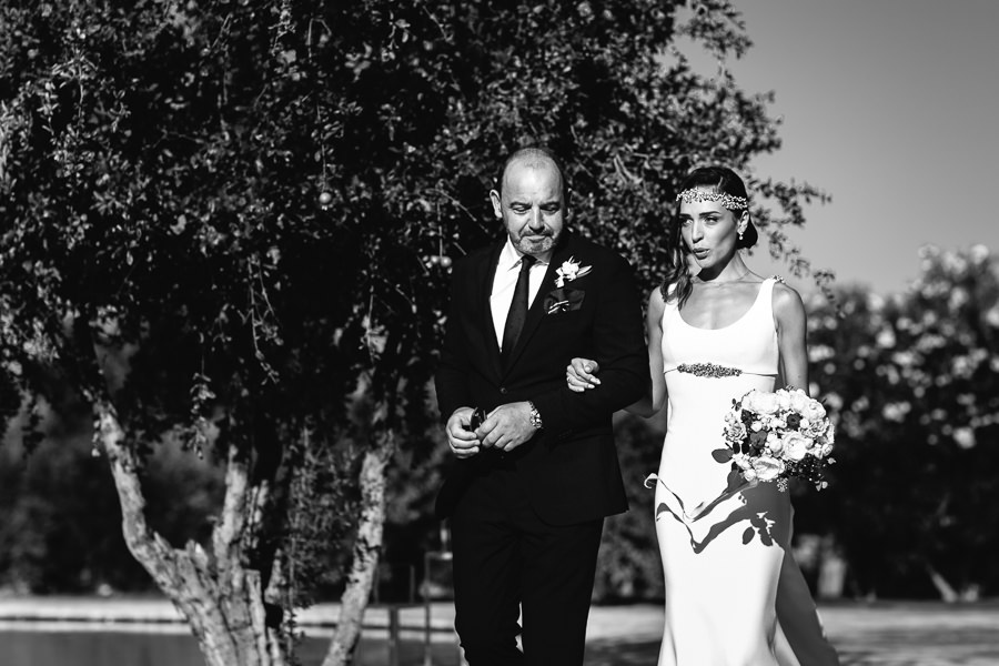 bride and her father walking down the aisle at wedding in ostuni