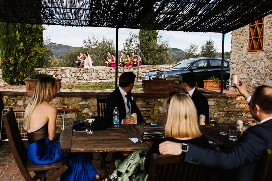 bridal party walking down at castello di meleto