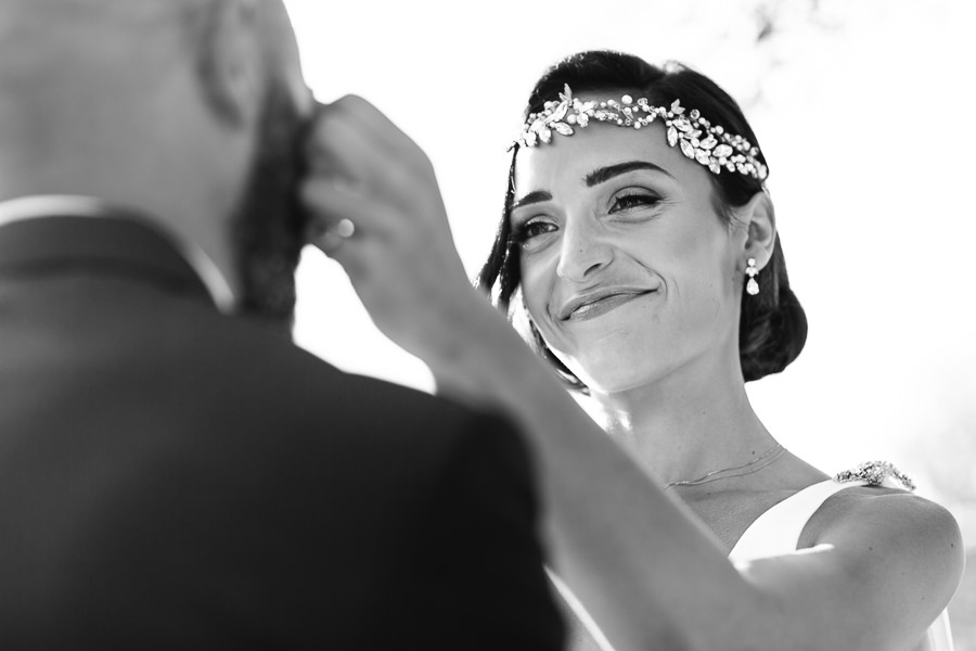sweet moment between bride and groom during wedding in apulia