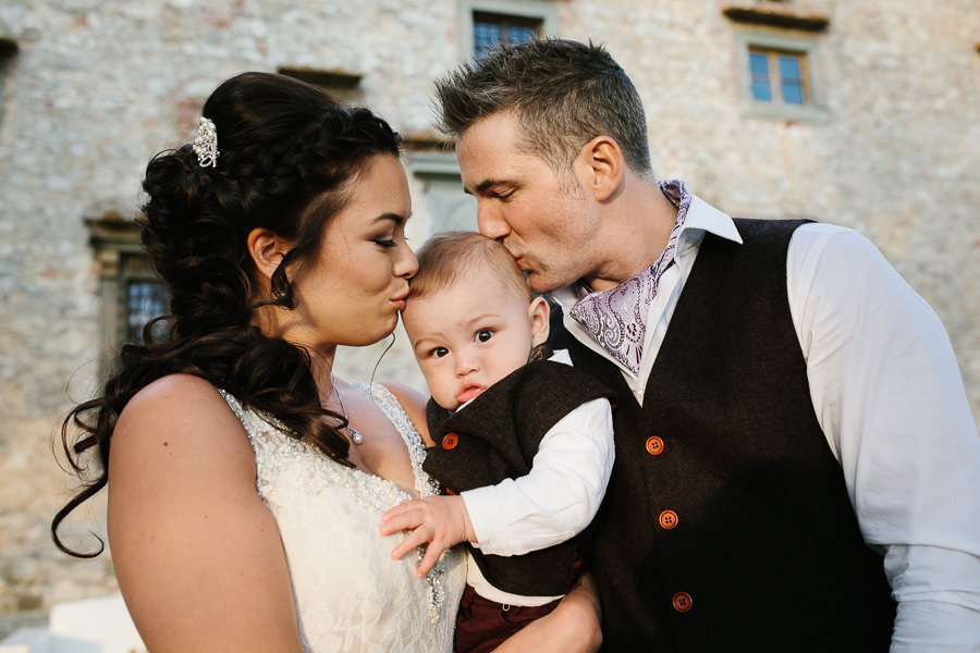 bride and groom with their son portrait