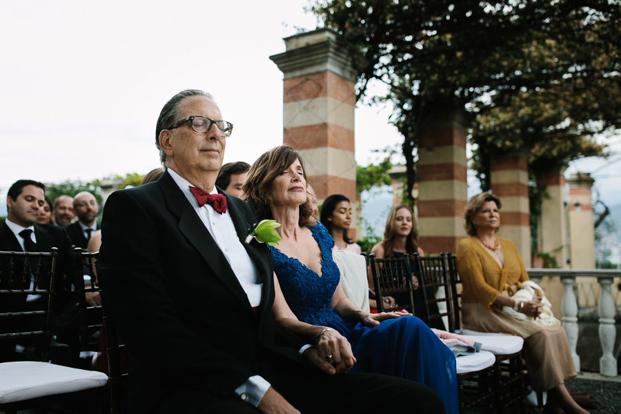 parents of the bride praying during wedding ceremony