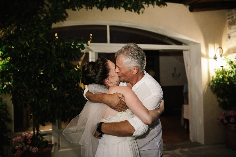 father kisses the bride