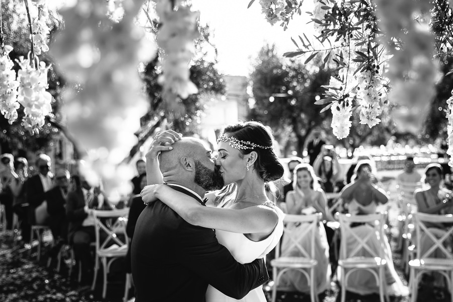 sweet moment between bride and groom during wedding in apulia