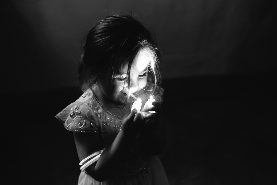 little girl playing with light
