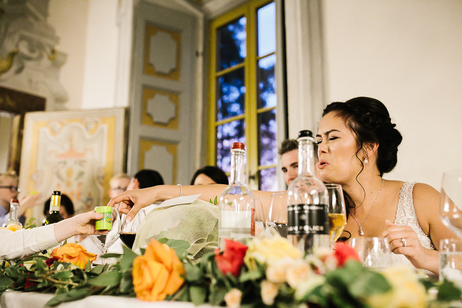 bride and girl playing with slime at wedding