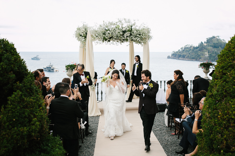 bride and groom walking off wedding ceremony la cervara portofino