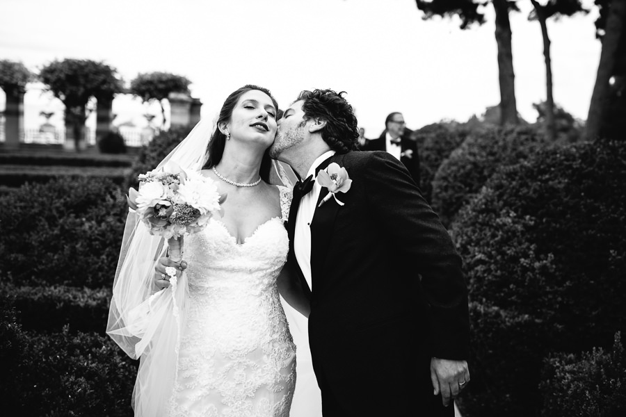 groom kissing bride in portofino