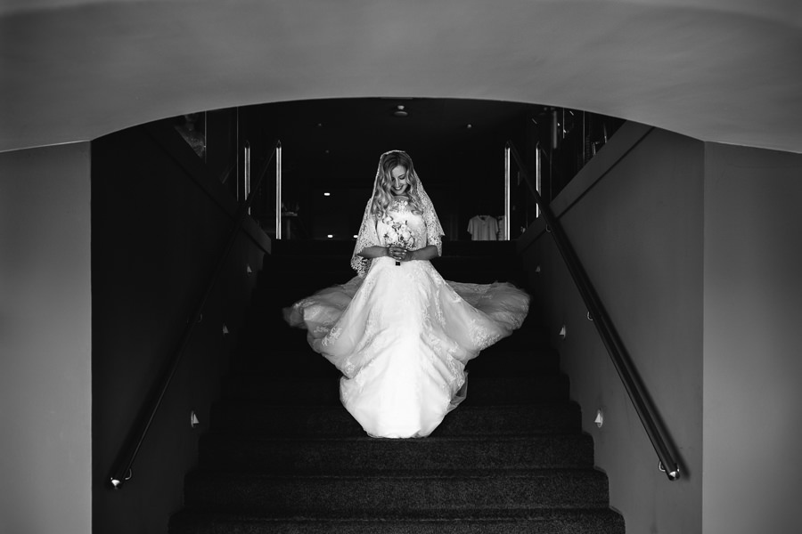 bride walking down the stairs at miramonti hotel meran