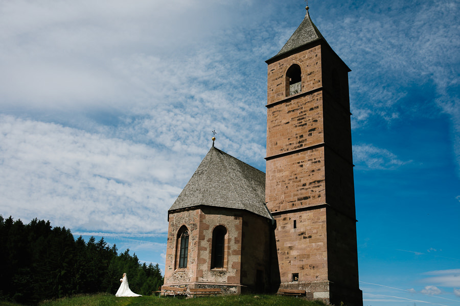 bride portrait in front of church in south tyrol