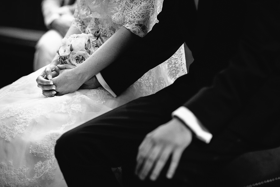 bride and groom holding hands