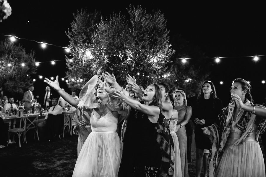 throwing the bouquet during wedding in apulia