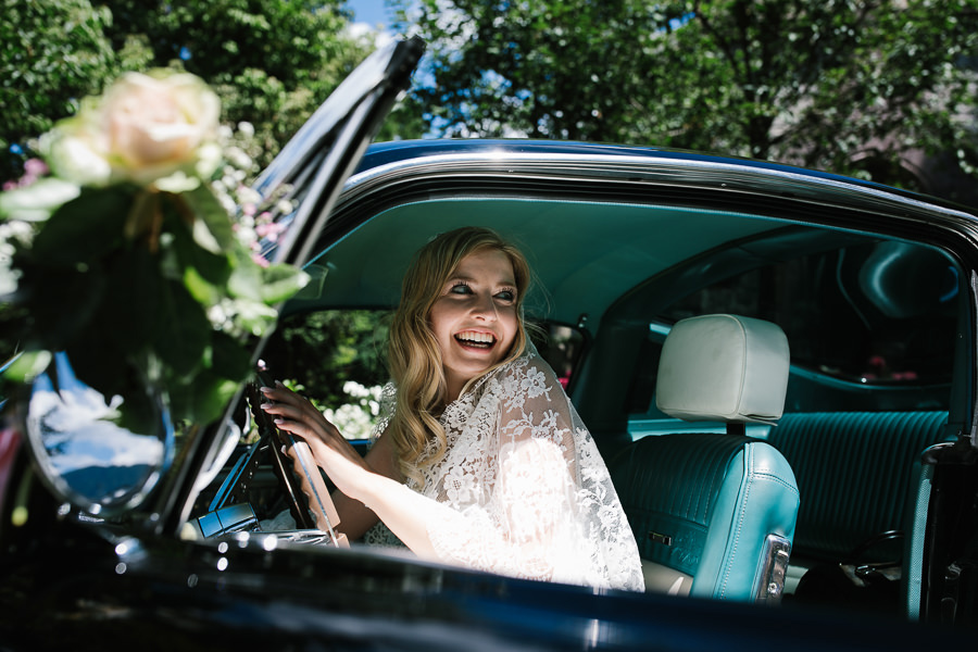 bride inside the wedding car mustang