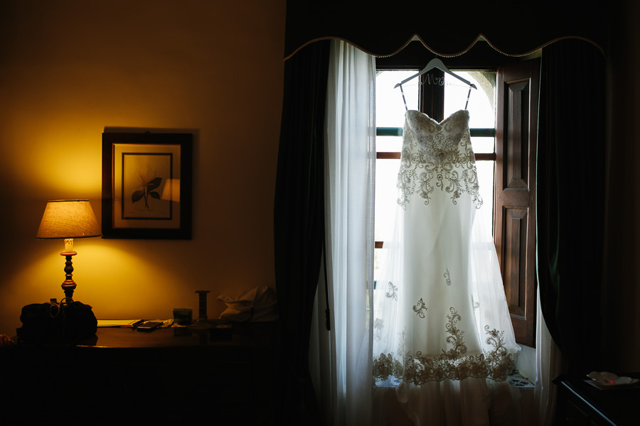 Bride dress in front of window