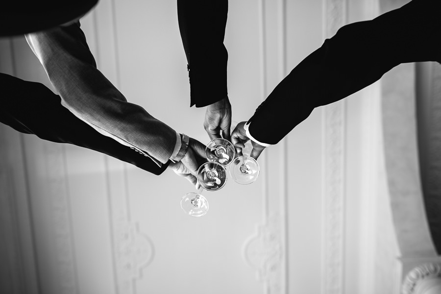 groom and groomsmen having a drink