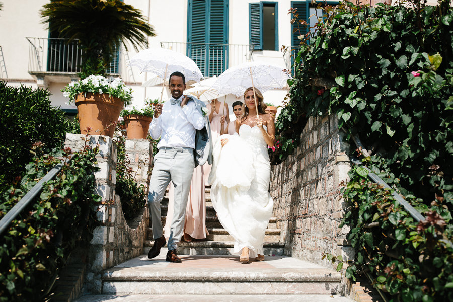 bride and groom under the hot sicilian sun