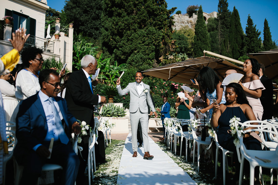 groom entrance outdoor ceremony taormina
