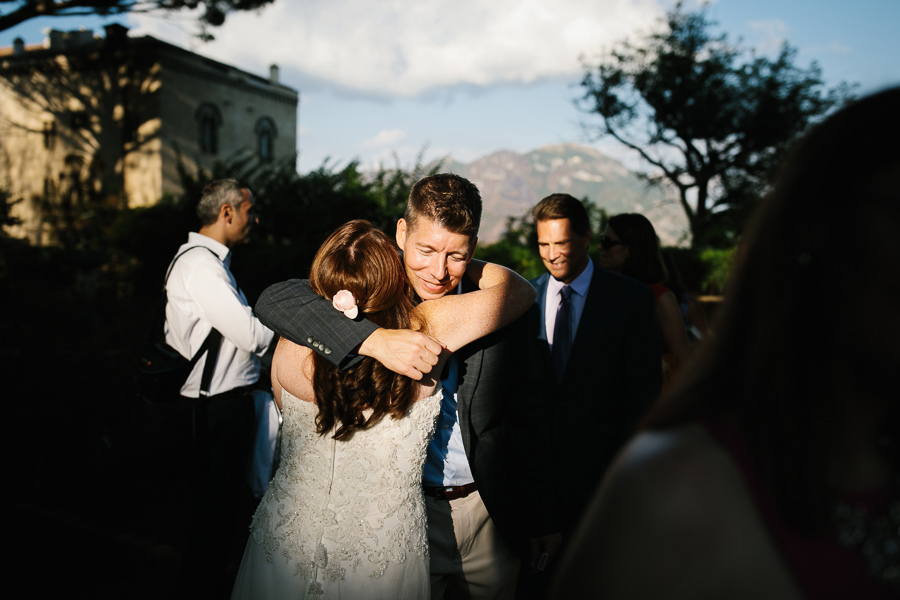 bride hugging a guest