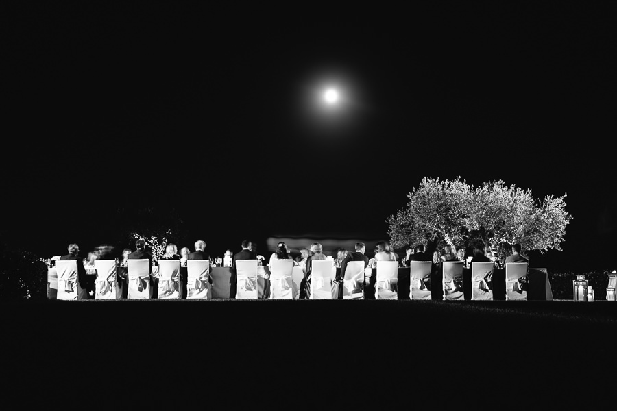 award winning photograph during wedding dinner with moon