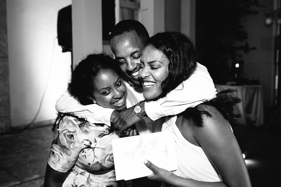 groom hugging his sisters during wedding at hotel timeo