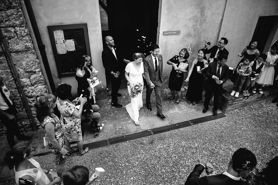 Wedding couple leaving church in Tuscany