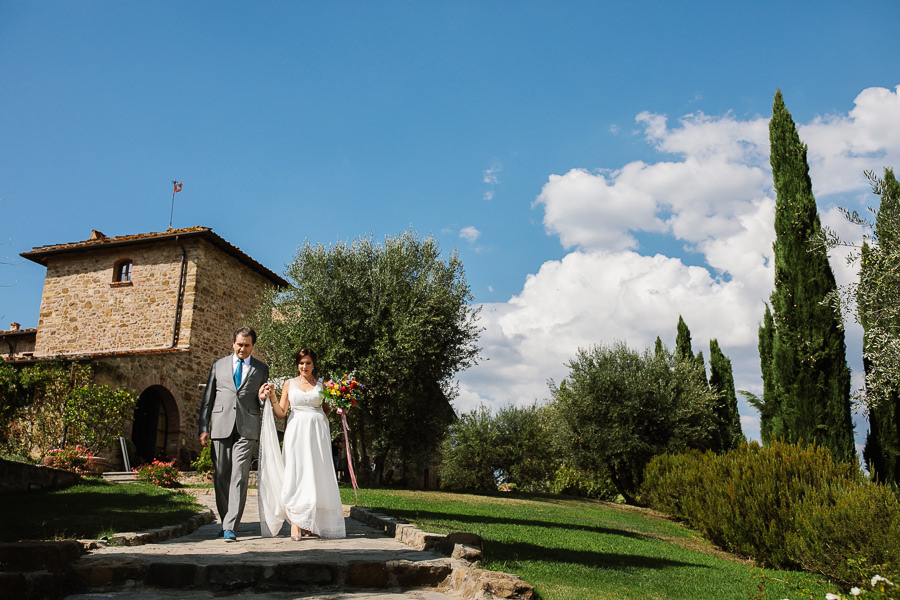 bride walking down the aisle in tuscany