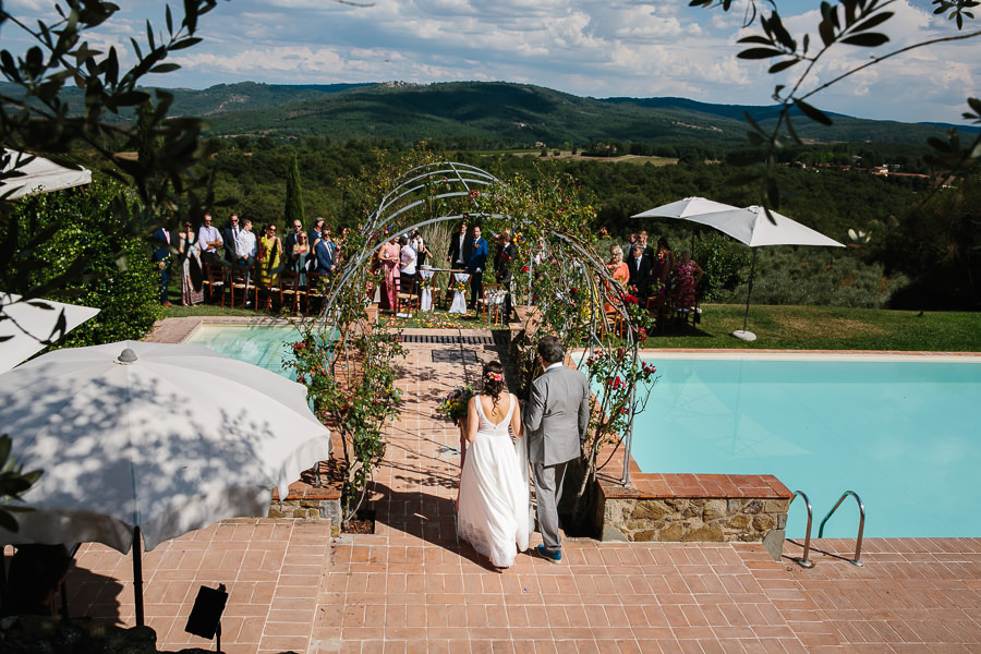bride walking down the aisle in tuscany