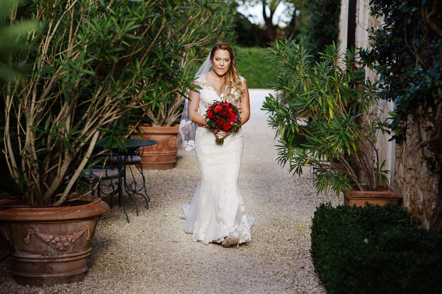 Bride walking down the aisle at Borgo Santo Pietro elopement wed