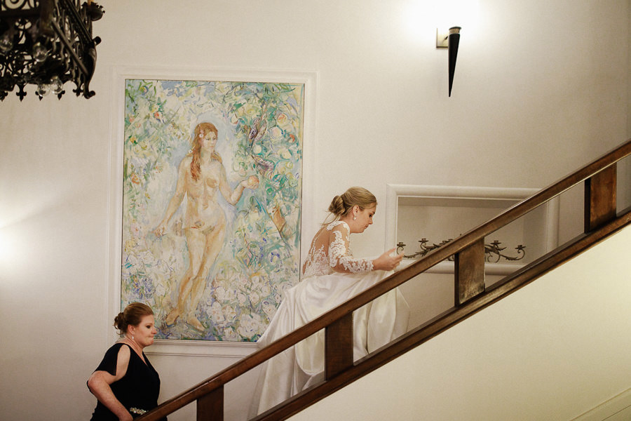 Bride walking up the stairs and changes dress at Villa Eva weddi